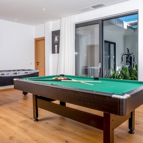 Let your competitive side shine with a game of pool or foosball in the games room 
