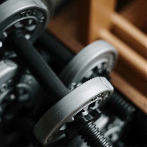 Lift weights in the building's on-site gym before setting off for the day