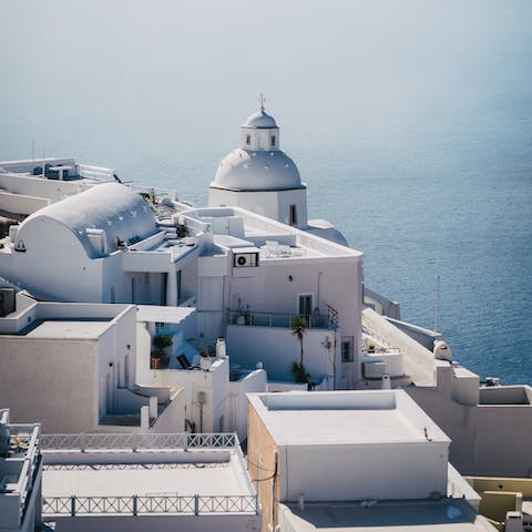 Go and explore the old town of Fira