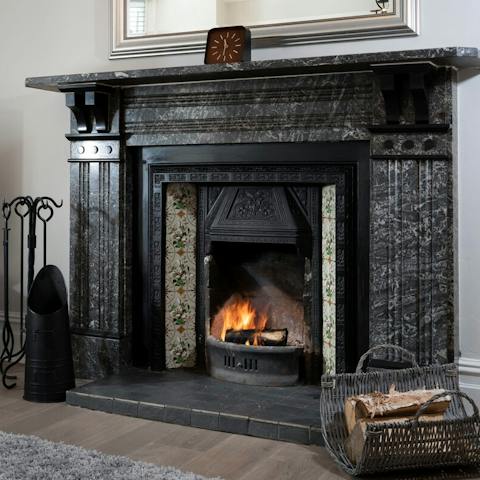 A stunning period fireplace to get nice and toasty