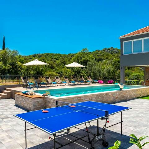 Unwind with a game of table tennis in your backyard
