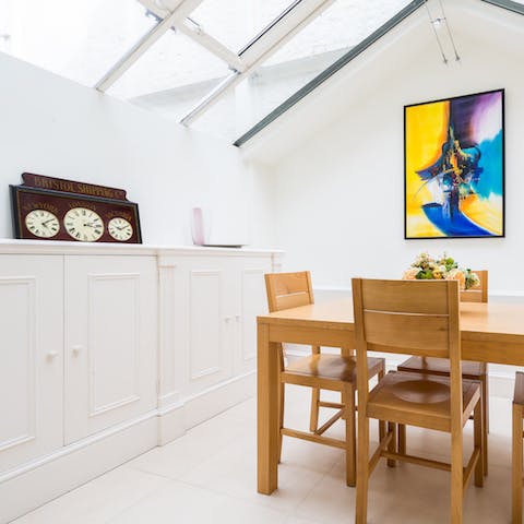 Gather for family dinners in the light and bright conservatory-style dining room