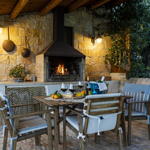 Enjoy glasses of local wine in the cosy barbecue nook, keeping an eye on it while it grills up a Sicilian feast