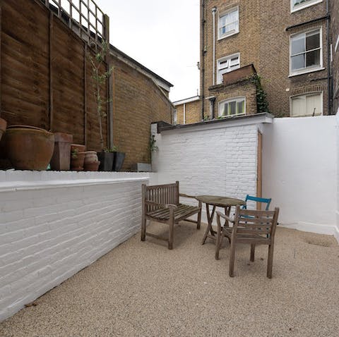Get some fresh air in the garden with its whitewashed walls