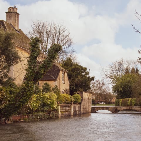 Drive twenty-five minutes to Bourton-on-the-Water and explore the picturesque Cotswolds town