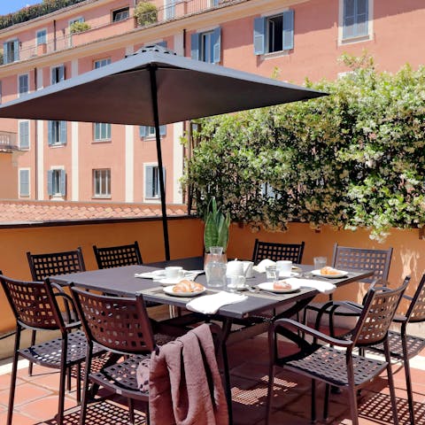 Enjoy breakfast out on your private terrace nestled among the rooftops