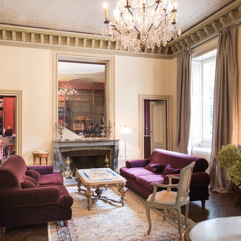 Relax in the grand Louis XIV style formal living room