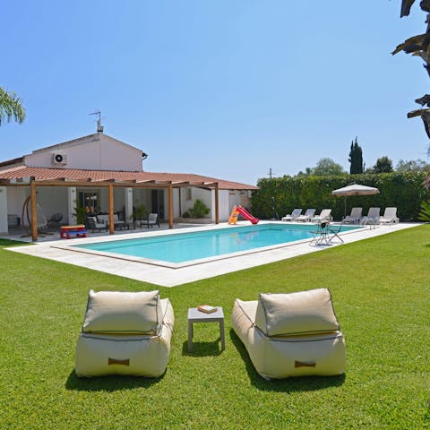 Soak up the Sicilian sun from in or beside the private pool
