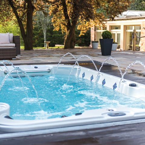 Partake in a pilates class around the swim spa, then enjoy a relaxing soak in the tub