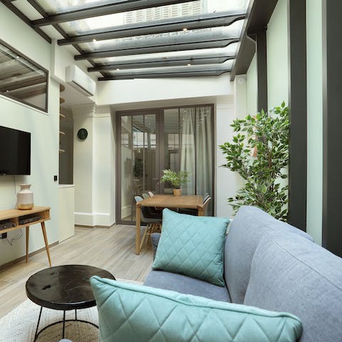 Relax on the sofa underneath the skylights before venturing out into the city
