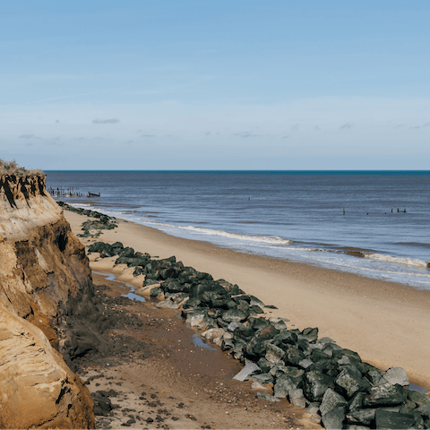 Stroll down a grassy path and reach the windswept Norfolk coastline in twenty minutes