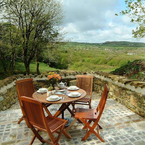 Enjoy breakfast on the patio with sweeping countryside views