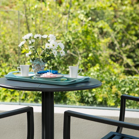 Pause for a quiet moment on the master bedroom's private balcony