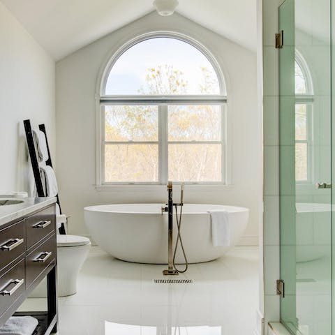 Relax in the freestanding bathtub before gathering in front of a cosy fireplace