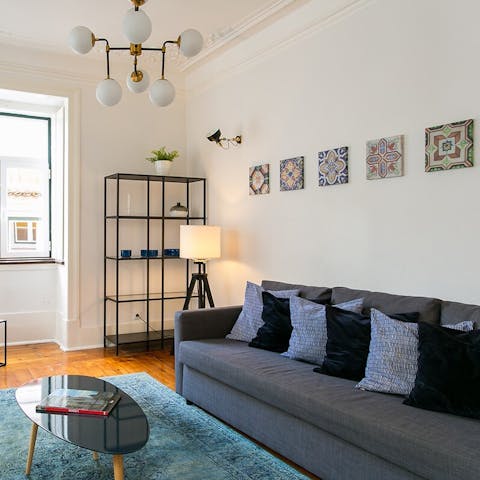 Unwind in the living room amidst the sleek interiors with touches of traditional Lisbon