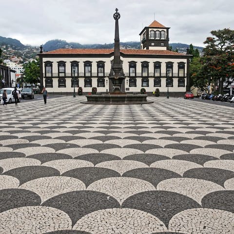 Visit the town square in Funchal, checkered with black and white Portuguese tiles 
