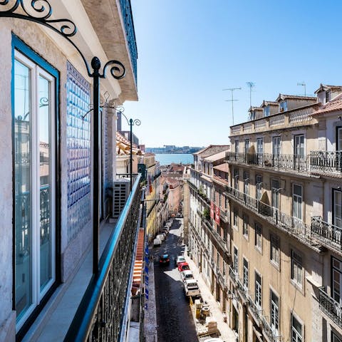 Take in the vistas over the district and the River Tagus from your balcony