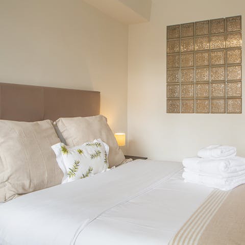 Treat yourself to a siesta on the king-size bed ahead of a long evening in Madrid