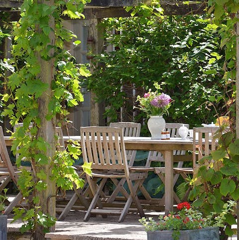 Enjoy  lunches and dinners outside under the vine-covered pergola