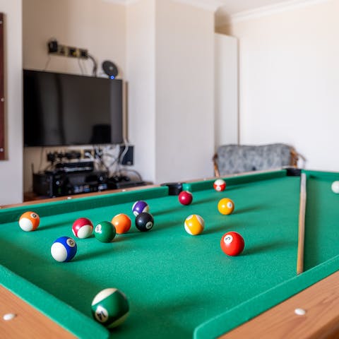 Pot the colours and the black during a game of pool