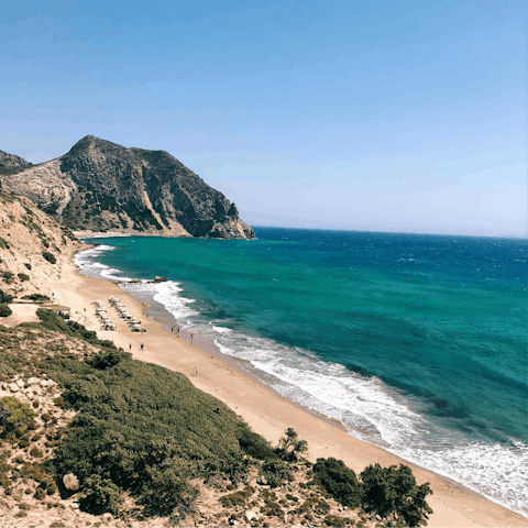 Sunbathe on the golden sands of the beach, just a three-minute drive away