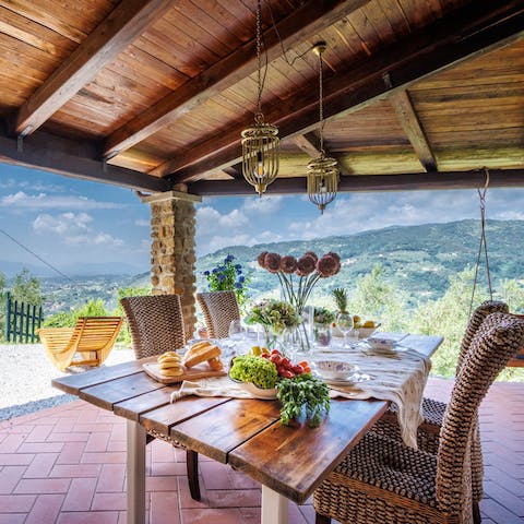 Gather around the dining table for alfresco meals overlooking the hills