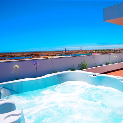 Unwind with your loved ones in the hot tub, overlooking the sun-soaked horizon