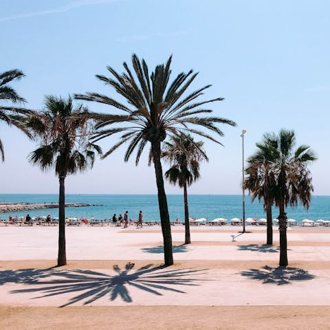 Spend the day sipping sangria and lounging on the gorgeous Barceloneta Beach – twenty-five minutes on the metro