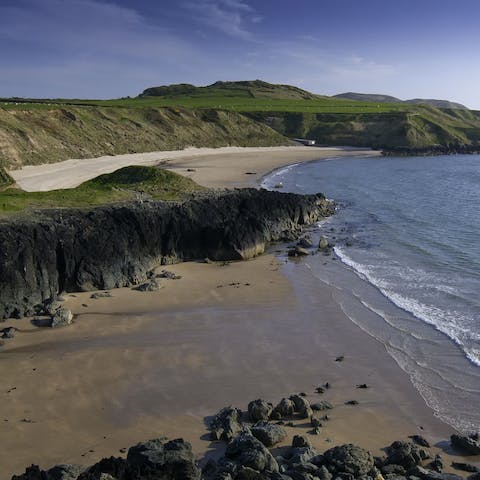 Visit the nearby rugged beach of Traeth Penllech, a great surfing beach for beginners