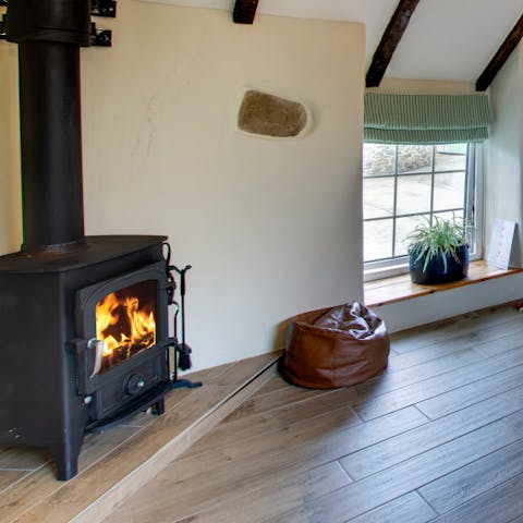 Cuddle up on the sofa next to the log burner fireplace on chilly winter evenings