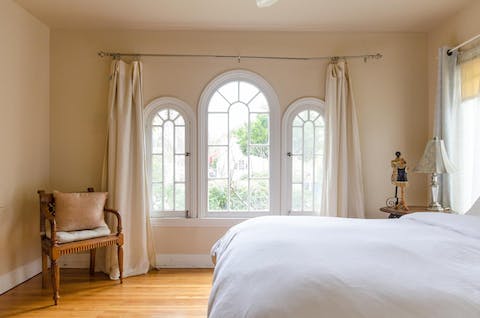 Gaze out through the bedroom's arched windows 