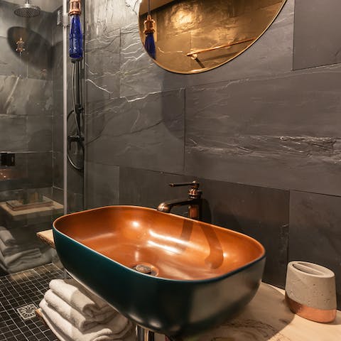 Brass basin in the slate bathroom
