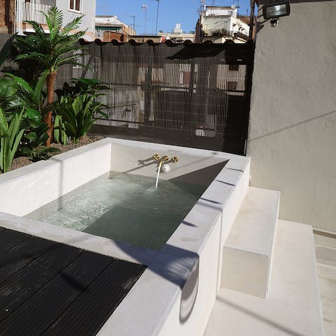 Take a dip in the rooftop plunge pool after a morning of sightseeing in Barcelona