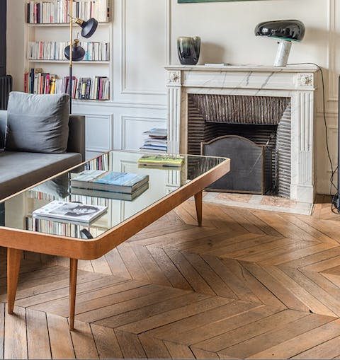 Intricate marble fireplaces and herringbone floors