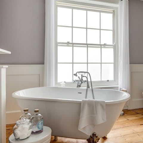 Soak in the gorgeous freestanding tub after a day exploring The Lanes
