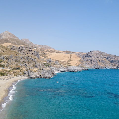 Paddle the crystal clear waters of Damnoni Beach, a short walk away