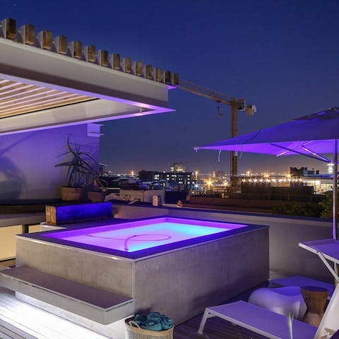 Look out at the Cape Town city skyline from your rooftop pool area, sipping on a nice glass of wine
