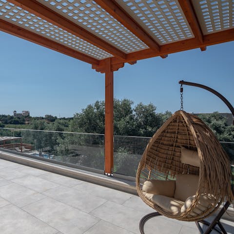 Take in scenic views of the surrounding greenery from the terrace 