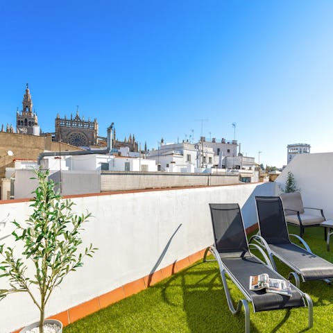 Take in the vistas of Seville Cathedral and the Giralda Tower from the private roof terrace