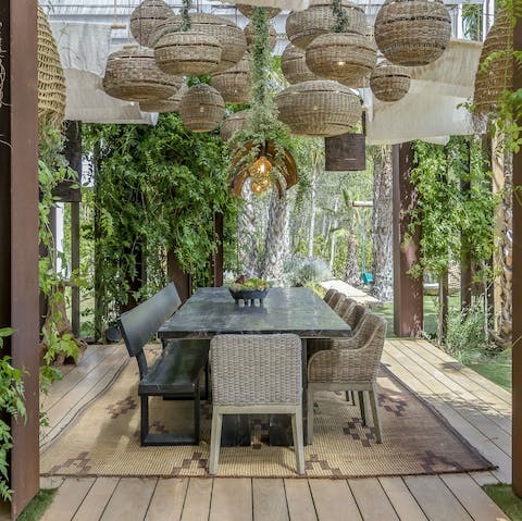 Organise big group dinners in the beautiful, plant-covered dining room