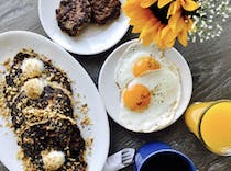 Grab Breakfast at Salt's Cure for their famous oatmeal griddle cakes