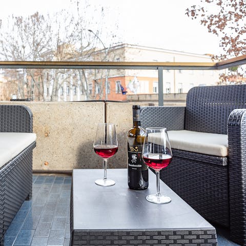 Enjoy a glass of barolo from your private balcony