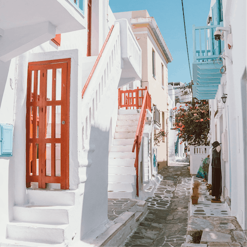 Explore vibrant Mykonos Town and its array of eateries and shops – it's a thirteen-minute drive away