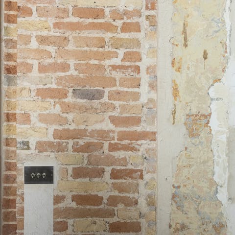 Exposed plaster and brickwork