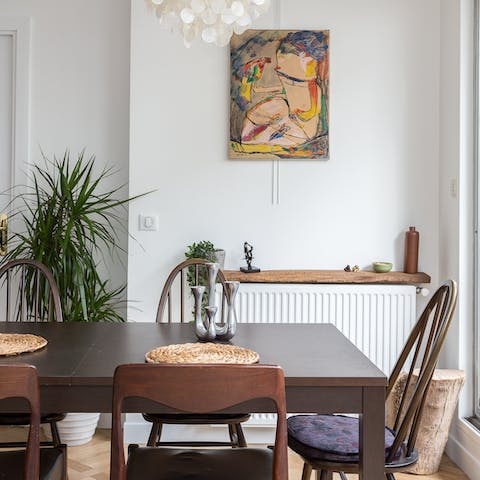 Come together in the art-filled and mid-century dining area