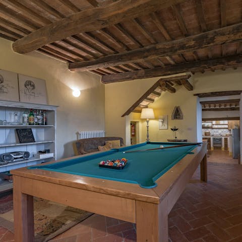 Play a few friendly games of pool in the games room