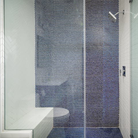 The spacious, tiled shower 