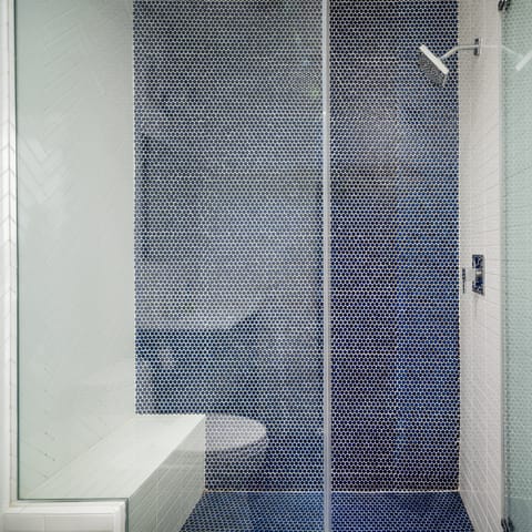 The spacious, tiled shower 
