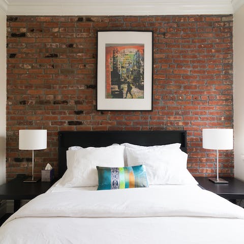 Admire the exposed brick walls in the bedroom and living area