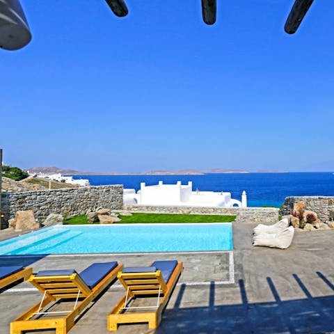 Swim in the private pool as the sea provides the perfect backdrop